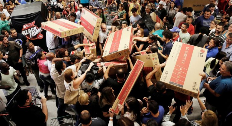masses of people fighting over packages on the night of black friday
